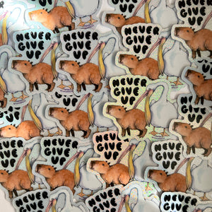 Never Give Up Capybara Pelican Holographic Glitter Vinyl Die Cut Durable Sticker